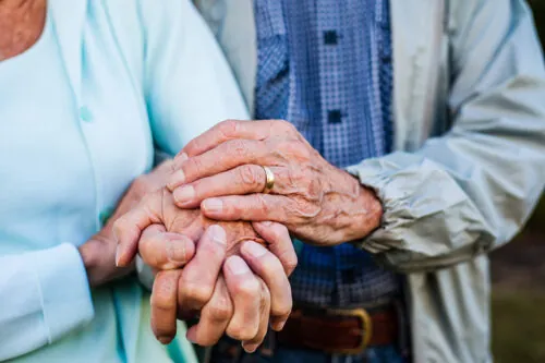 Holding hands elderly