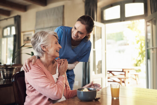 Young nurse checking up on a senior woman